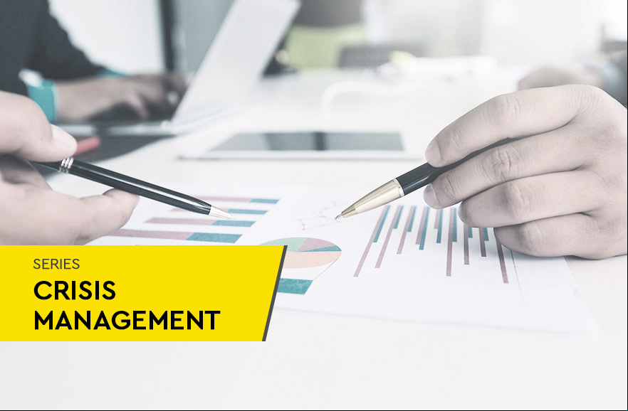 Image cropping with hands and pens analyzing graphs.