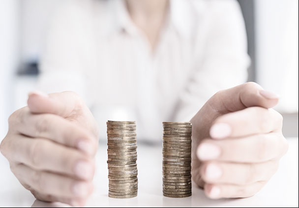 Two stacks of coins of the same size on a table